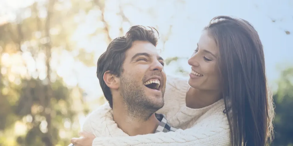 A smiling couple outdoors, representing life after a supported benzodiazepine taper